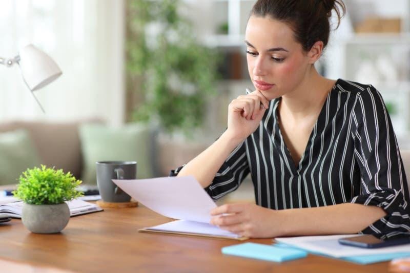 A woman checks her pet sitting instructions